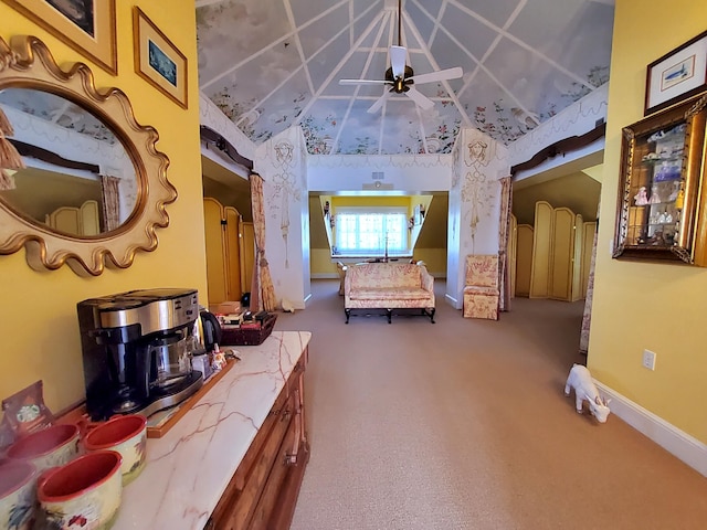 interior space with lofted ceiling, carpet floors, and baseboards