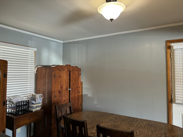 dining area with crown molding