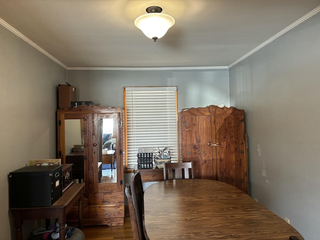 dining area featuring ornamental molding