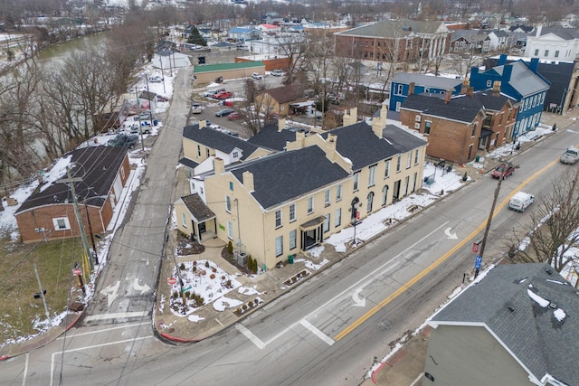 snowy aerial view with a residential view