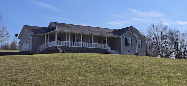 view of front of home featuring a front yard, covered porch, a garage, crawl space, and metal roof