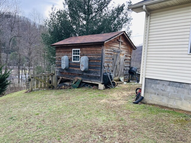 view of shed featuring fence