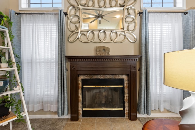 details with a glass covered fireplace and a ceiling fan