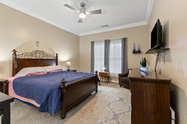 bedroom with crown molding, a ceiling fan, visible vents, and light colored carpet