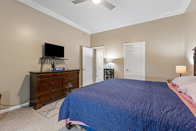 carpeted bedroom with a ceiling fan and crown molding