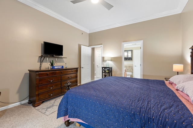 bedroom with ornamental molding, light colored carpet, ensuite bathroom, and a ceiling fan