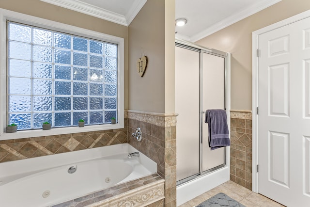 full bathroom featuring tile walls, ornamental molding, a jetted tub, a shower stall, and tile patterned floors