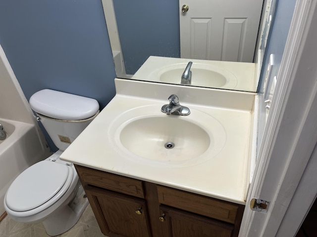 full bathroom with vanity, toilet, and a bath