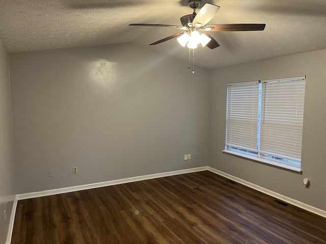 unfurnished room with baseboards, a textured ceiling, visible vents, and dark wood-type flooring