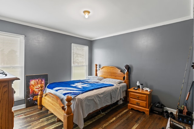 bedroom with baseboards, wood-type flooring, and crown molding