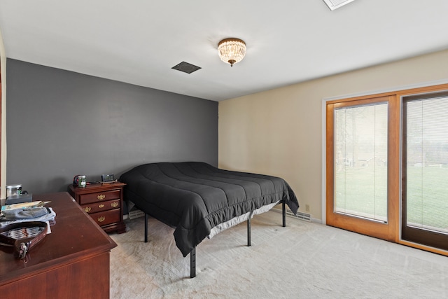 bedroom with carpet floors and multiple windows