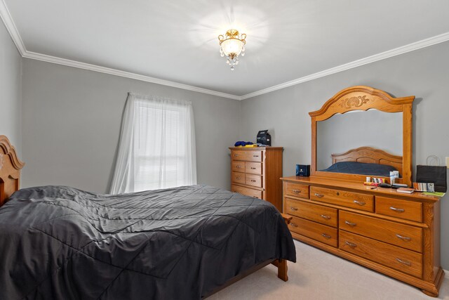 bedroom with light carpet and ornamental molding