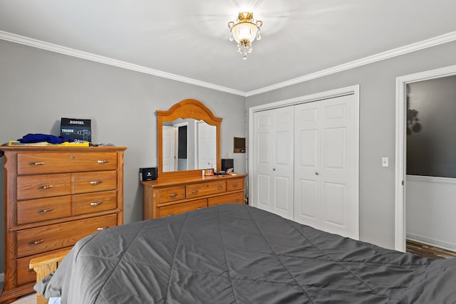 bedroom featuring a closet and crown molding