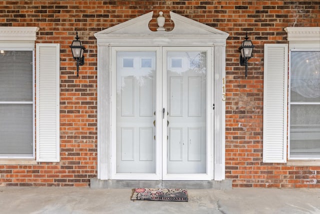 entrance to property with brick siding