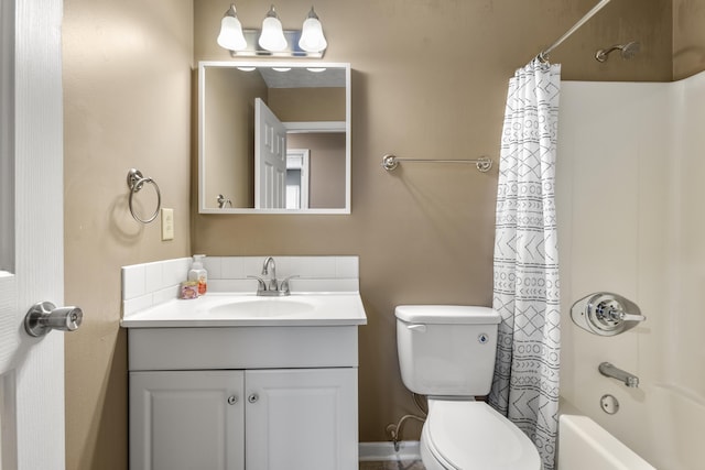 full bathroom featuring shower / tub combo with curtain, vanity, and toilet