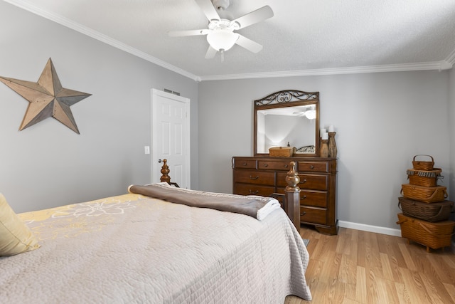 bedroom featuring crown molding, ceiling fan, a textured ceiling, light wood-type flooring, and baseboards