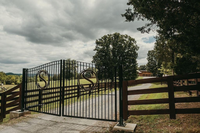 view of gate with fence