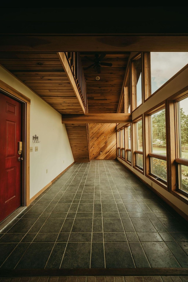 unfurnished sunroom with lofted ceiling and wooden ceiling