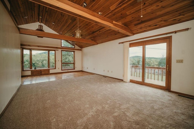 unfurnished room featuring a wealth of natural light, wooden ceiling, and beamed ceiling