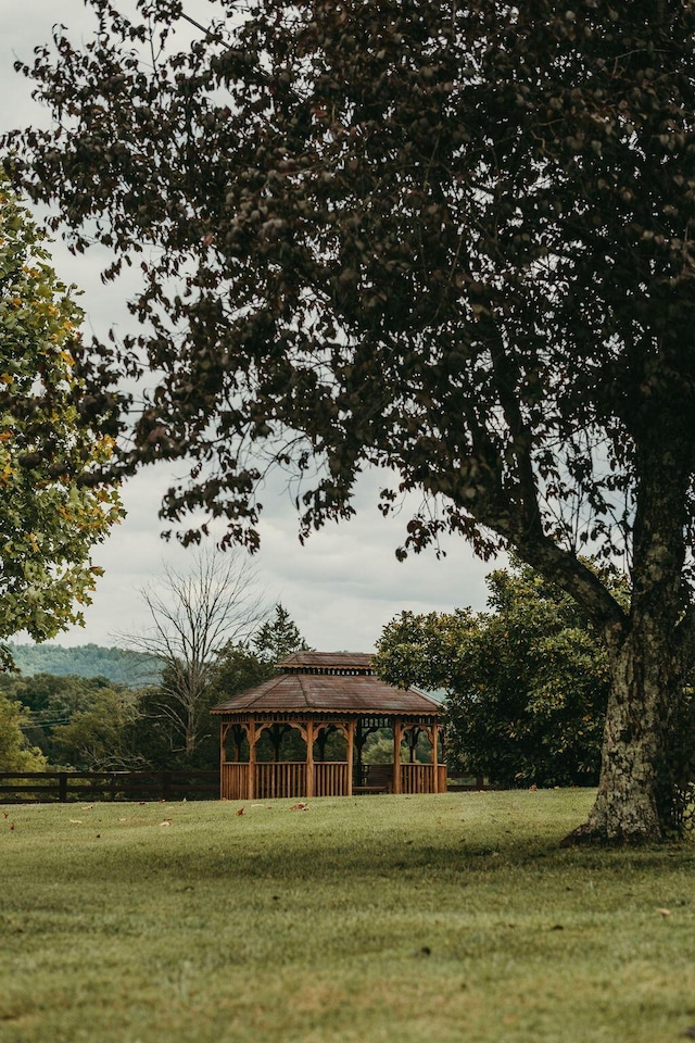 view of community with a lawn and a gazebo