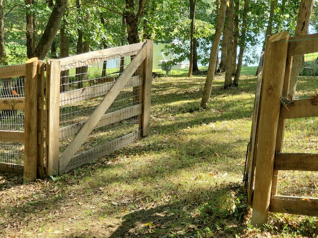 view of gate with fence