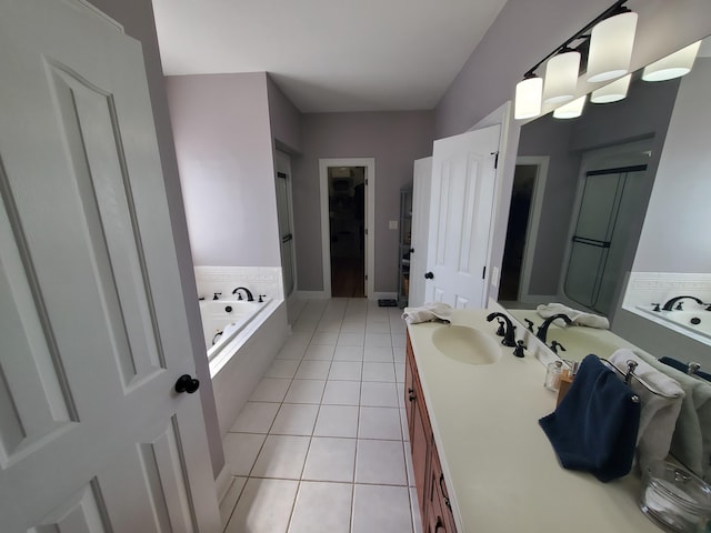 full bath featuring tile patterned floors, vanity, and a bath