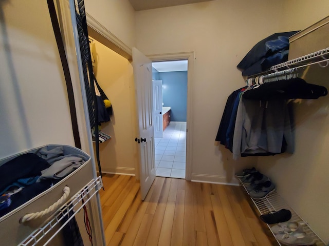 walk in closet featuring light wood-style floors