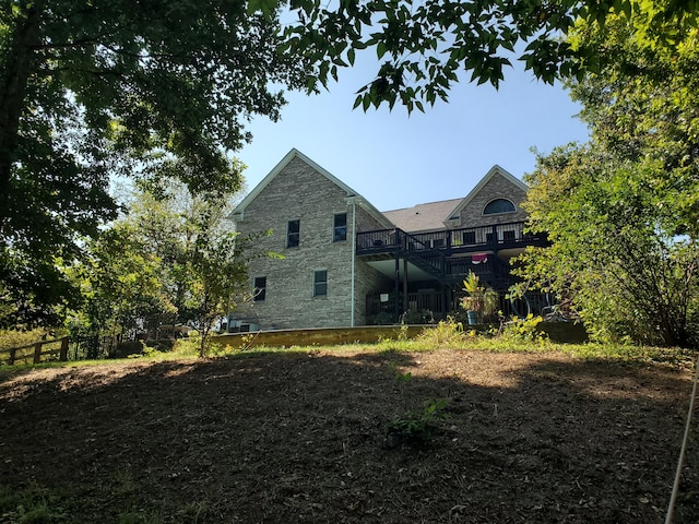 back of house with fence