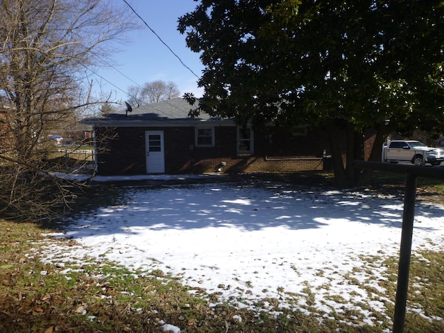 view of front of property featuring brick siding