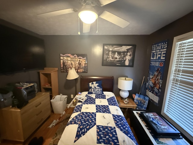 bedroom with ceiling fan and wood finished floors