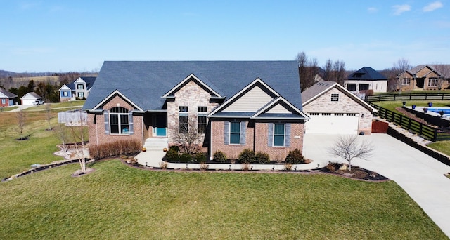 craftsman-style house featuring a garage, brick siding, fence, driveway, and a front lawn