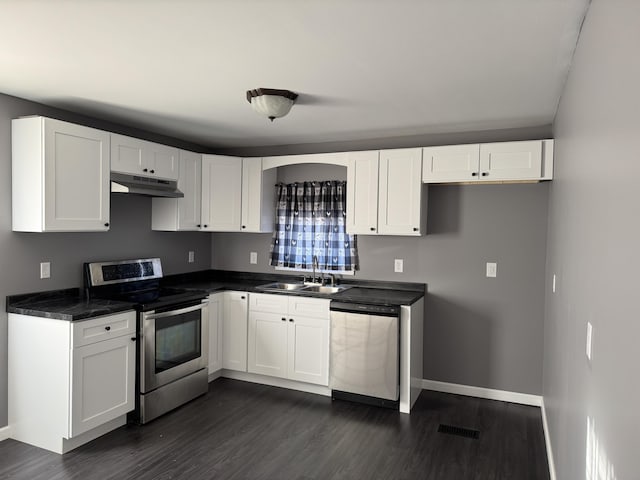 kitchen featuring white cabinets, under cabinet range hood, and stainless steel appliances