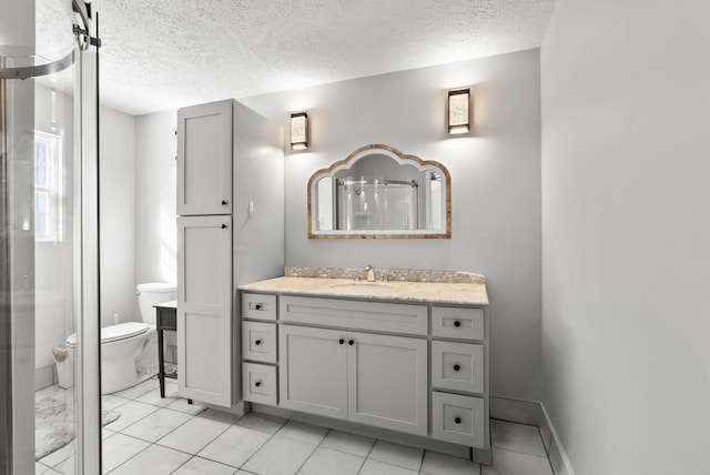 full bath with a textured ceiling, a shower, vanity, and toilet