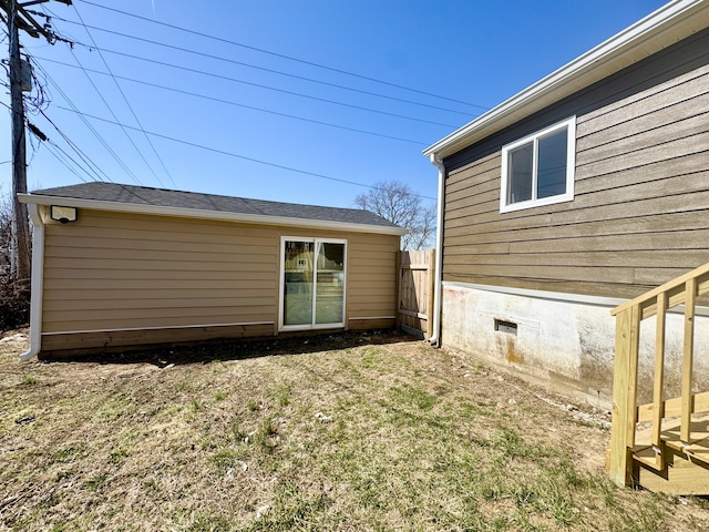 exterior space featuring crawl space, a yard, and fence