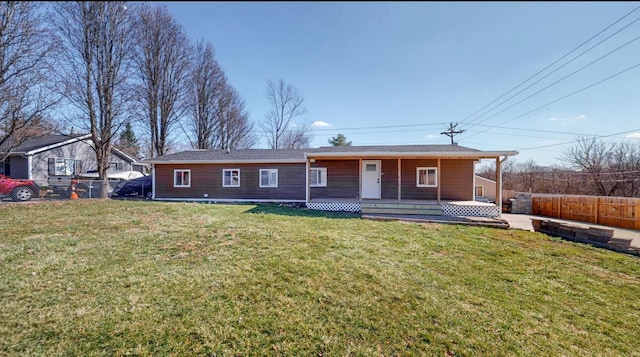 single story home featuring a front lawn, a porch, and fence