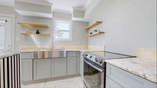 kitchen with open shelves, a sink, gray cabinetry, range with electric stovetop, and crown molding