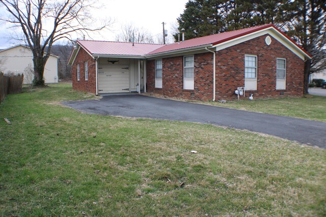 single story home with metal roof, driveway, and brick siding