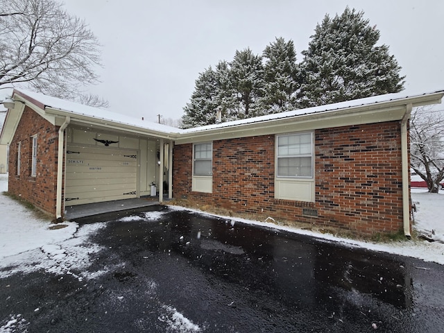 exterior space with metal roof and brick siding