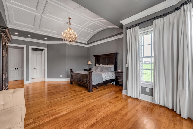 bedroom with baseboards, lofted ceiling, ornamental molding, light wood-type flooring, and a chandelier