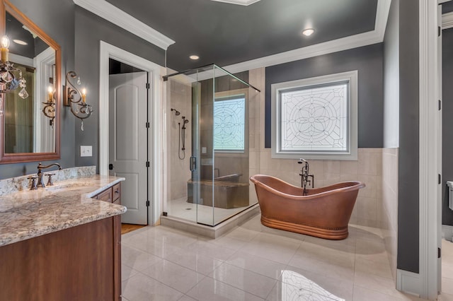 full bath with a freestanding tub, crown molding, vanity, and a shower stall