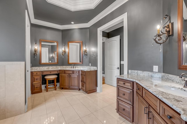 full bath with crown molding, tile patterned flooring, two vanities, and a sink