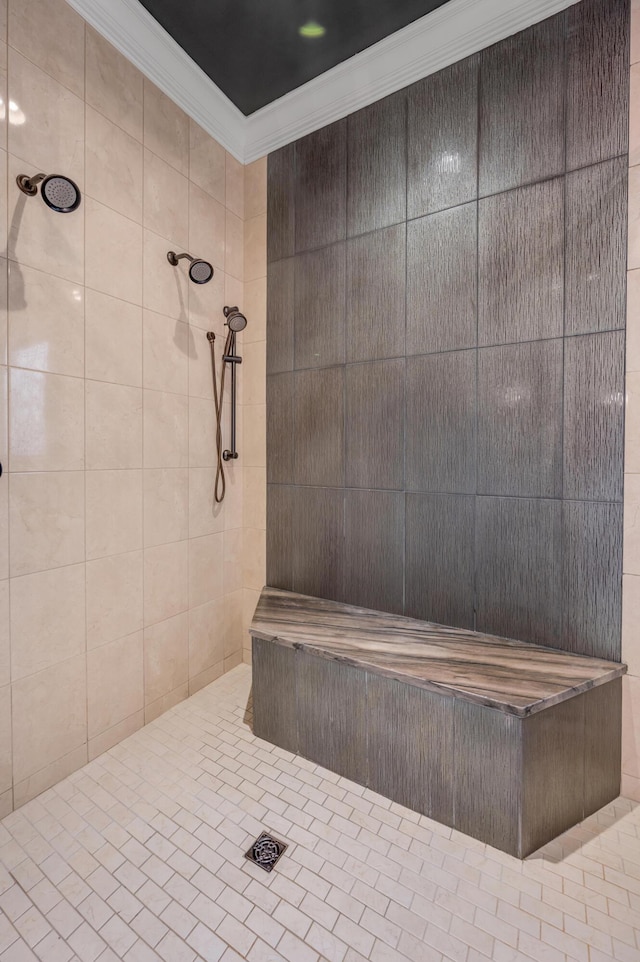 full bath featuring crown molding and tiled shower