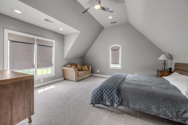 bedroom featuring light colored carpet, visible vents, vaulted ceiling, ceiling fan, and baseboards