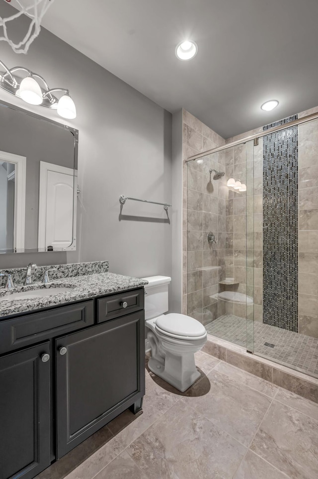 full bath featuring toilet, a shower stall, recessed lighting, and vanity