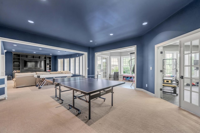 recreation room featuring recessed lighting, french doors, light carpet, and baseboards