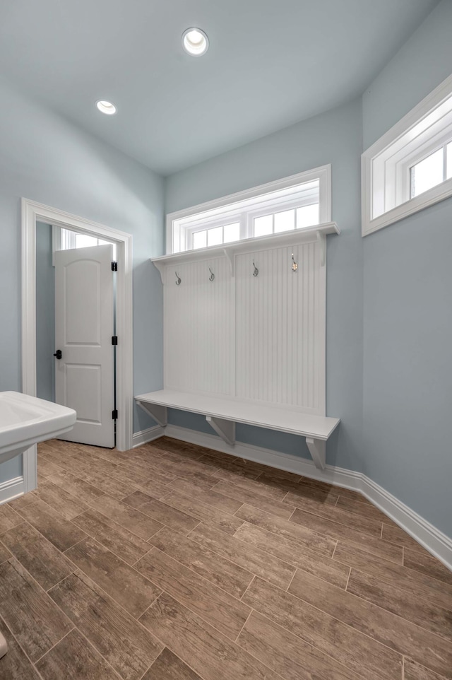 mudroom with baseboards, wood finish floors, and recessed lighting