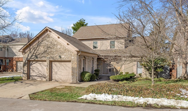 traditional-style home featuring a garage, stone siding, roof with shingles, and driveway