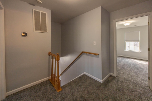 staircase featuring carpet, visible vents, and baseboards