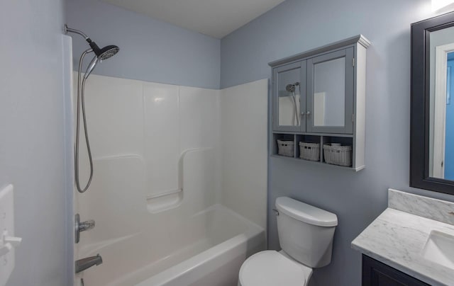 bathroom with toilet, vanity, and shower / tub combination