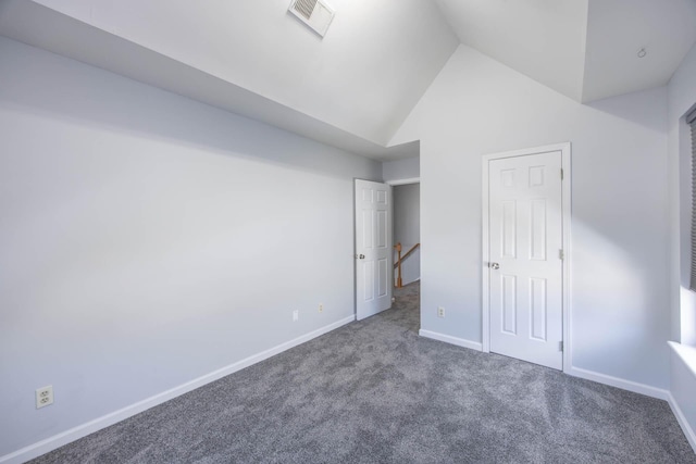 unfurnished bedroom featuring dark colored carpet, high vaulted ceiling, visible vents, and baseboards